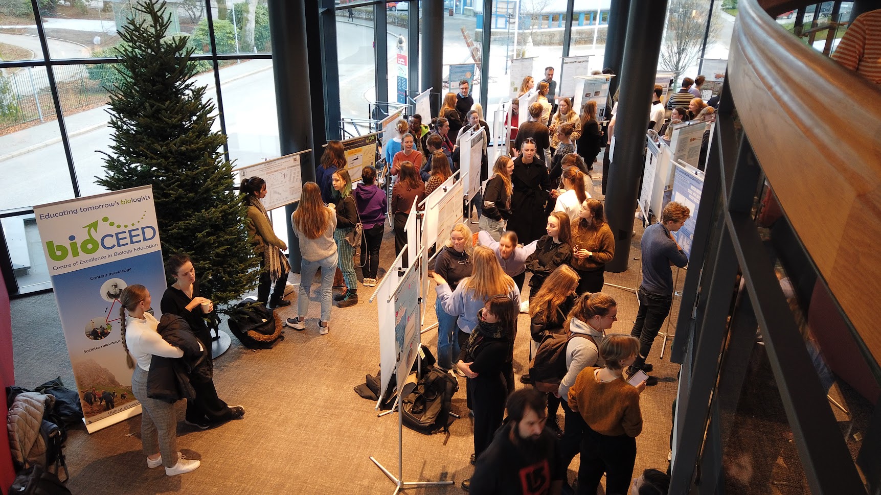 Students gathered at Vilvite for the poster symposium